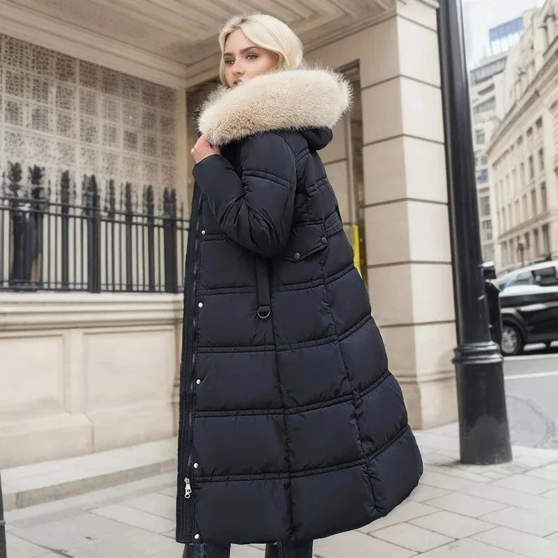 Parka longue matelassée pour femme avec capuche bordée de fausse fourrure