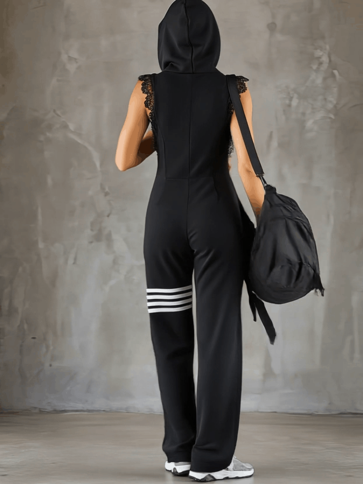 Combinaison sportive à capuche pour femme avec fermeture éclair et jambes larges