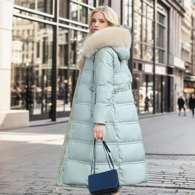 Parka longue matelassée pour femme avec capuche bordée de fausse fourrure