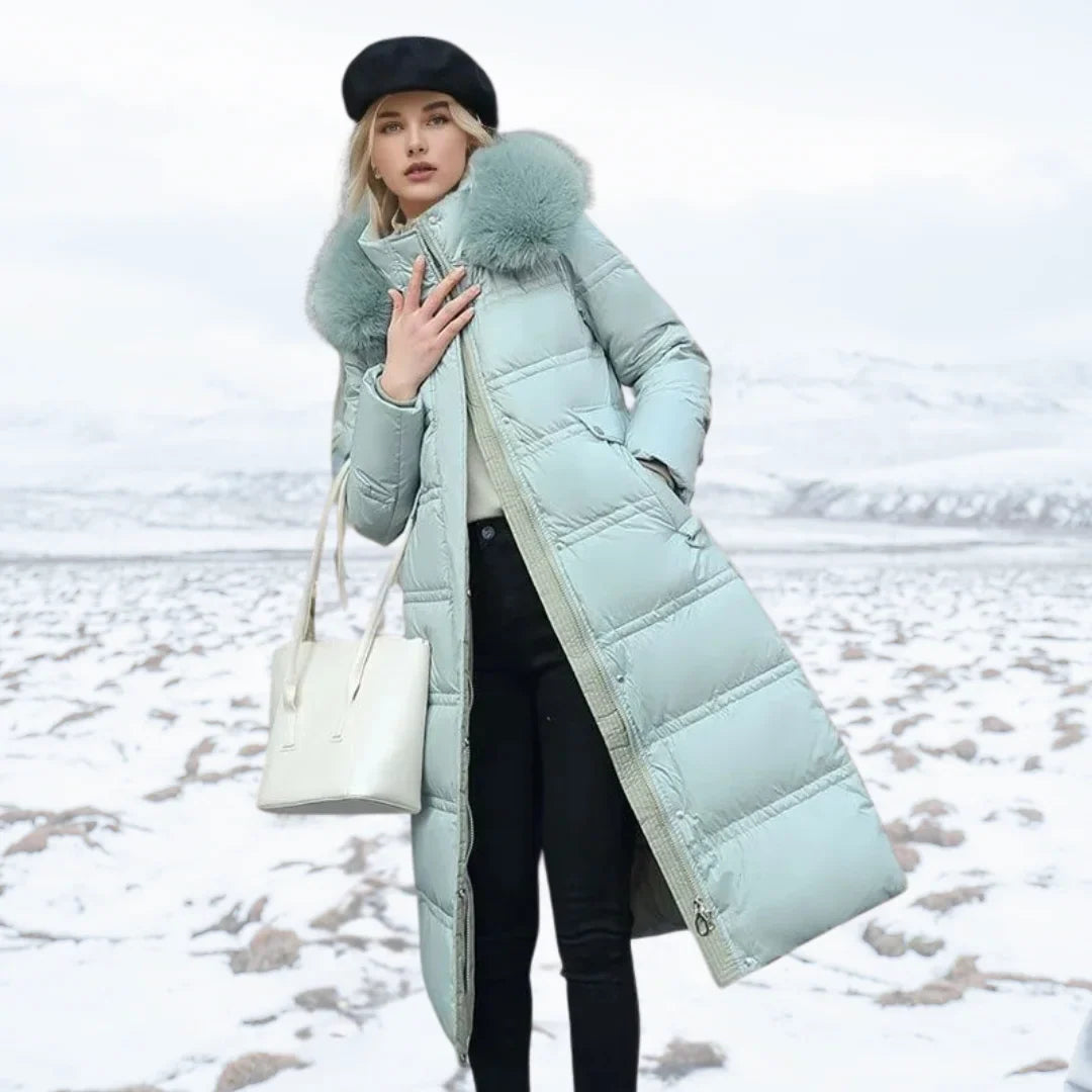 Parka longue matelassée pour femme avec capuche bordée de fausse fourrure