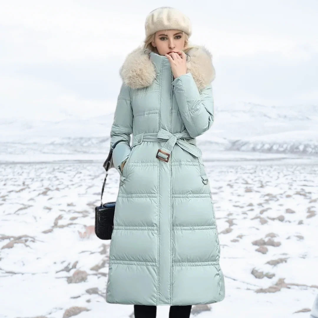 Parka longue matelassée pour femme avec capuche bordée de fausse fourrure