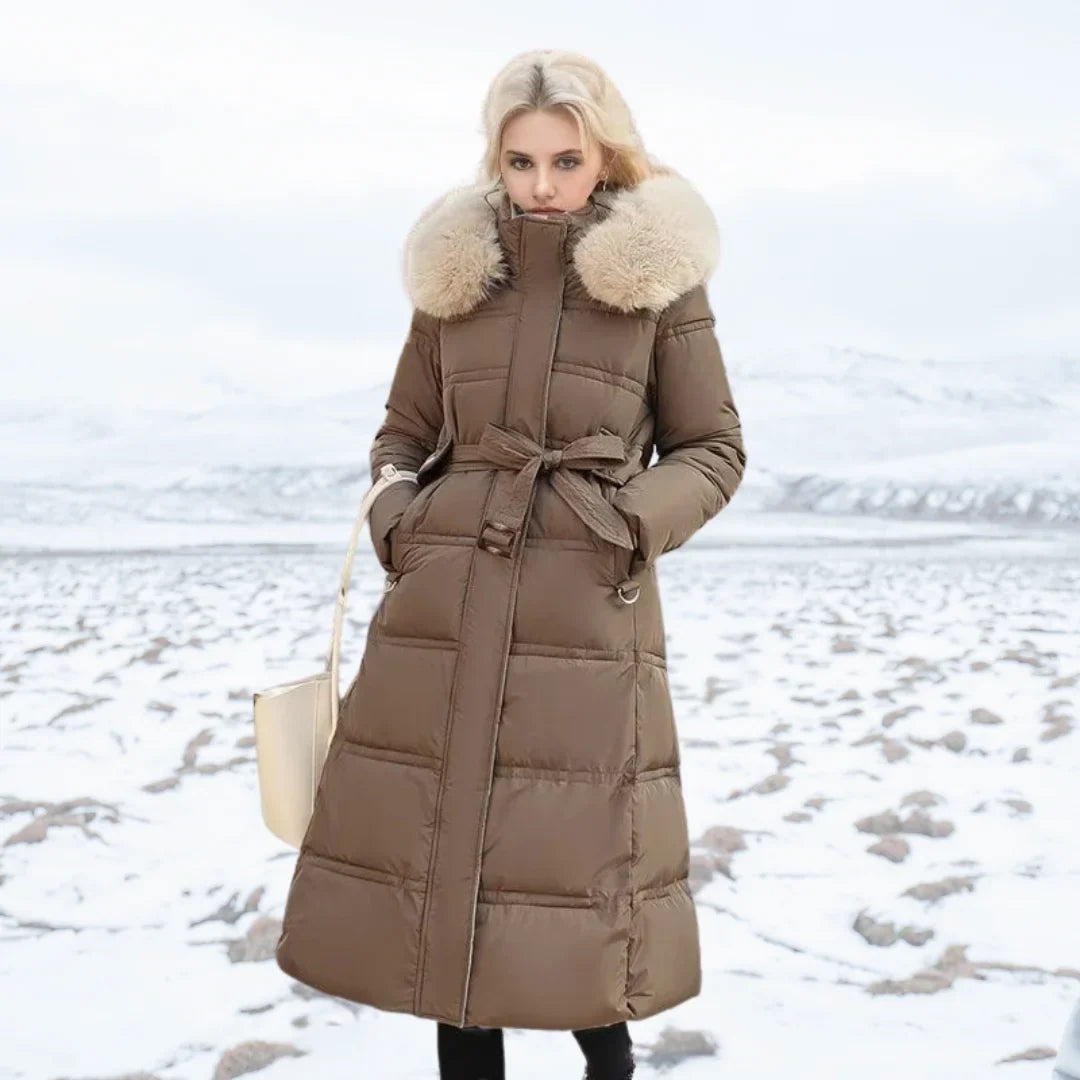 Parka longue matelassée pour femme avec capuche bordée de fausse fourrure